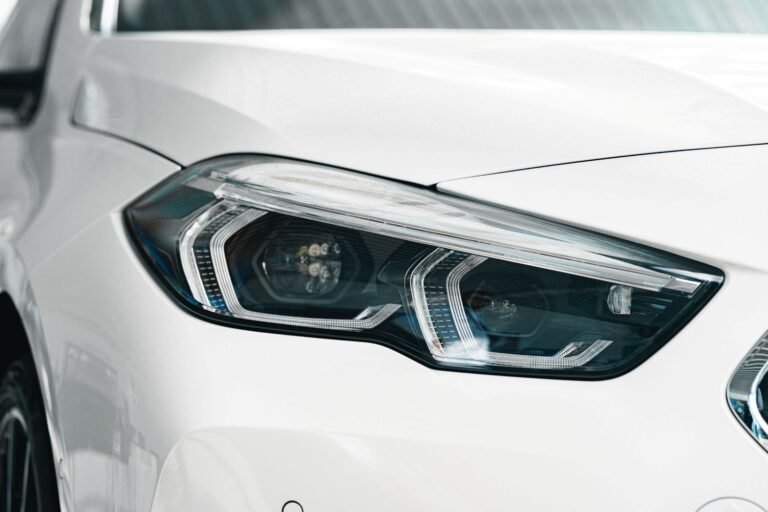 close-up-of-car-headlight-on-white-vehicle-2026-01-08-05-08-30-utc.jpg