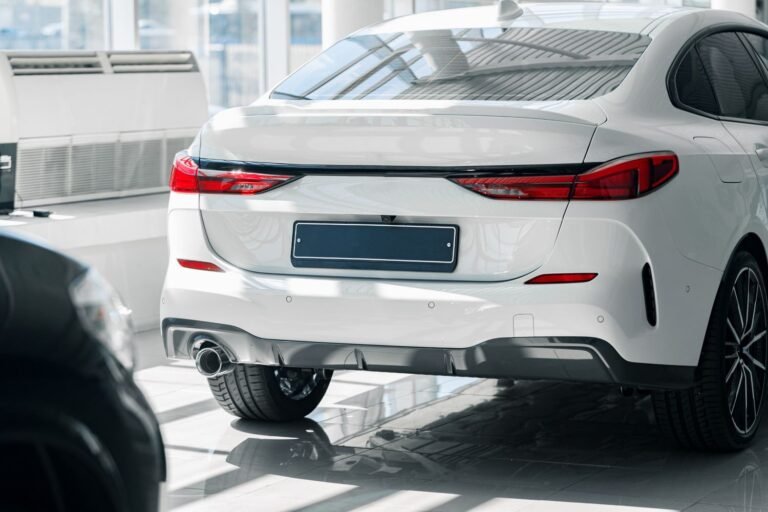 elegant-white-car-in-a-dealership-showroom-2026-01-08-05-08-20-utc.jpg