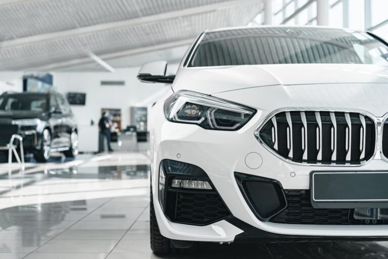 white-vehicle-interior-showroom-with-man-in-backgr-2026-01-09-06-33-23-utc.jpg